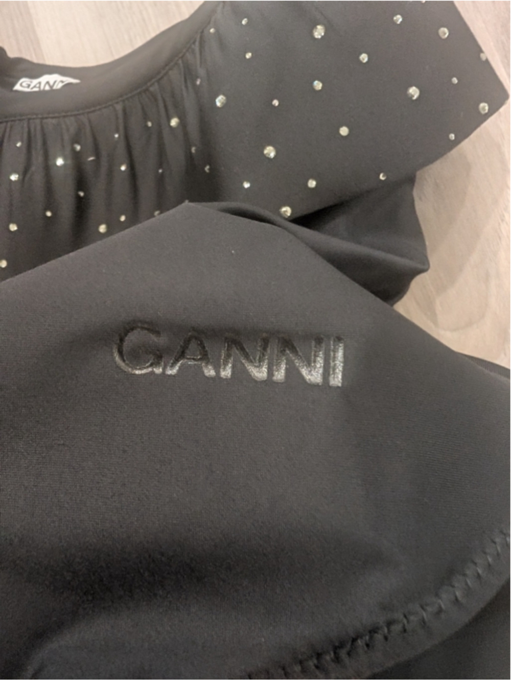 GANNI | Ruffled Rhinestone One-Shoulder Bodysuit In Black - Picture 7 of 11